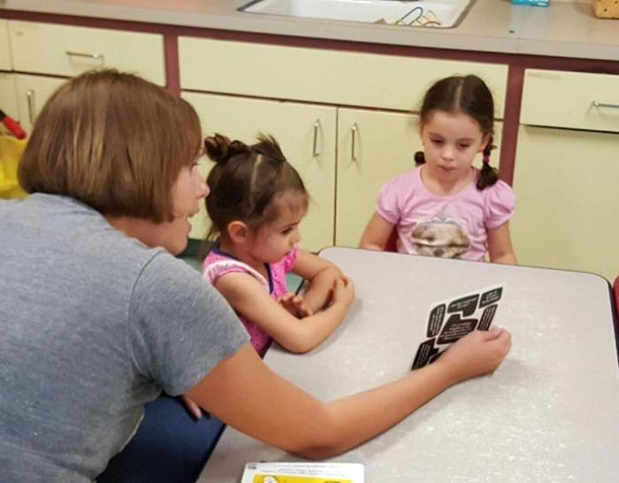 Amy Reed-Sandoval using the methods of philosophy to encourage children to think through big questions at Rayito del Sol Daycare and Learning Center in El Paso. Photo by Iván Sandoval-Cervantes.