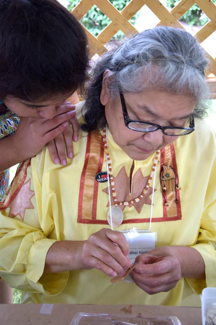 Yvonne Walker Keshick with her granddaughter teaching quillwork on birch bark at the Great Lakes Folk Festival, East Lansing, August 8, 2015. Photo by Pearl Yee Wong.