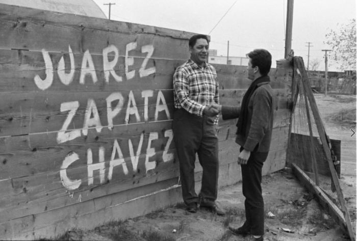 Men gathered in support of the Delano Grape Strike in Delano, California (ca.1966).  Photo by Emmon Clarke and © CSUN Tom and Ethel Bradley Center. 