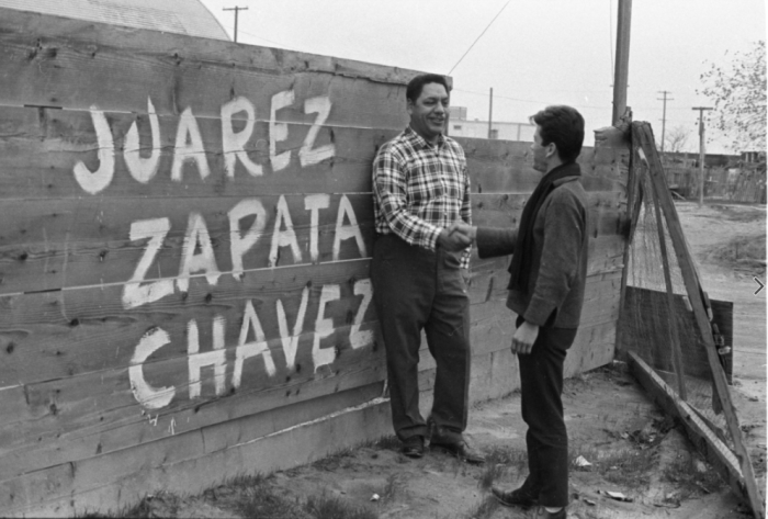 Men gathered in support of the Delano Grape Strike in Delano, California (ca.1966). Photo by Emmon Clarke and © CSUN Tom and Ethel Bradley Center. Men gathered in support of the Delano Grape Strike in Delano, California (ca.1966). Photo by Emmon Clarke and © CSUN Tom and Ethel Bradley Center.