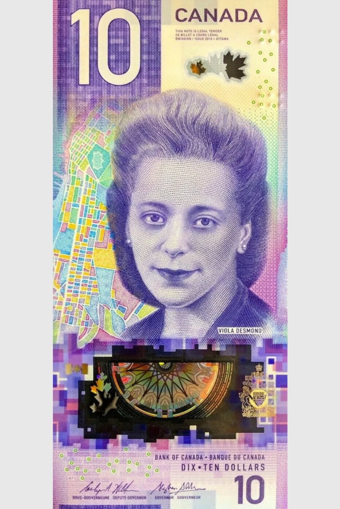 A $10 bill issued by the Bank of Canada featuring Viola Desmond, a Black businessperson and Civil Rights activist A $10 bill issued by the Bank of Canada featuring Viola Desmond, a Black businessperson and Civil Rights activist