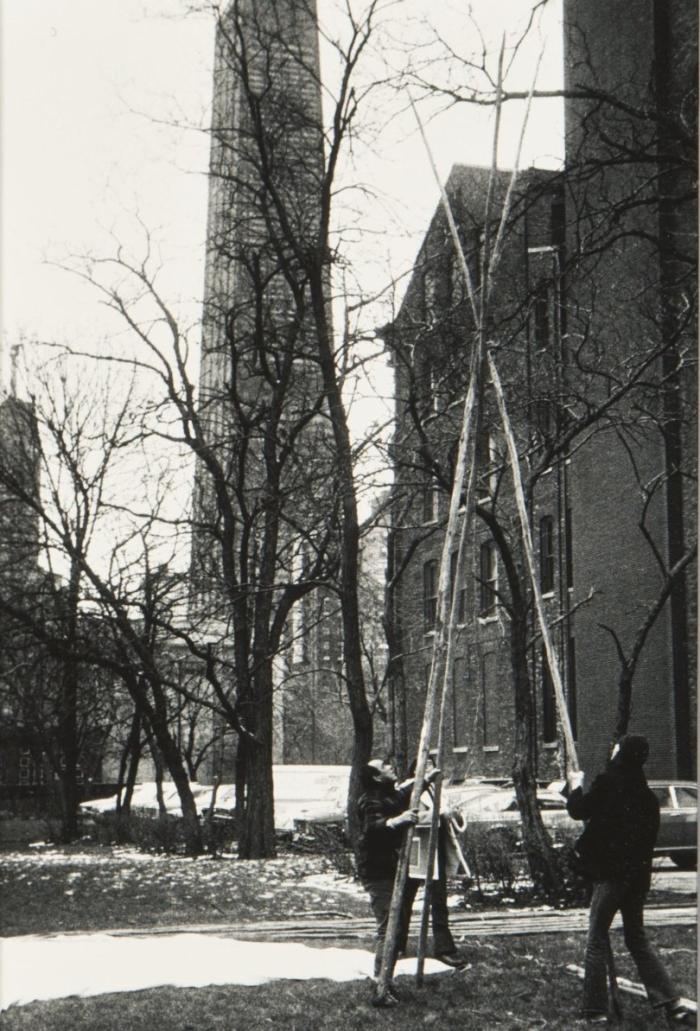 Native community members raise a tipi to be used at the ceremony blessing the founding of the D'Arcy McNickle Center in 1971. Photograph by Peter F. Weil. Ayer MS Seeing Indian Collection, Newberry Library. 