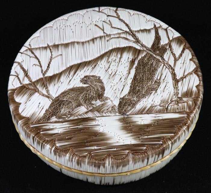 A quill box featuring otters made by Yvonne Walker Keshick using all natural quills. Image courtesy of MSU Museum collections, ID 2017:24.108. Photo by Pearl Yee Wong. A quill box featuring otters made by Yvonne Walker Keshick using all natural quills. Image courtesy of MSU Museum collections, ID 2017:24.108. Photo by Pearl Yee Wong.
