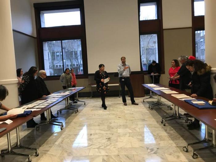 Native community members view collection items at a community meal held at the Newberry Library in January 2020 to discuss the Indigenous Chicago project Native community members view collection items at a community meal held at the Newberry Library in January 2020 to discuss the Indigenous Chicago project